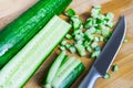 Cut a fresh cucumber to prepare different dishes.