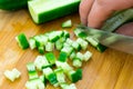 Cut a fresh cucumber to prepare different dishes.