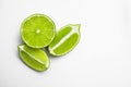 Cut fresh juicy limes on white background Royalty Free Stock Photo