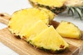 Cut fresh juicy pineapple on wooden board Royalty Free Stock Photo