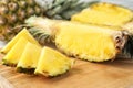 Cut fresh juicy pineapple on wooden board Royalty Free Stock Photo