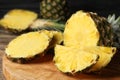 Cut fresh juicy pineapple on wooden board Royalty Free Stock Photo
