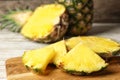 Cut fresh juicy pineapple on wooden board Royalty Free Stock Photo
