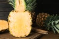 Cut fresh juicy pineapple on wooden board, closeup Royalty Free Stock Photo