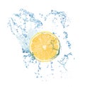 Cut fresh lemon and splashing water on white background Royalty Free Stock Photo