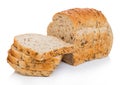 Cut of fresh loaf of seeded bread on white background. Traditional bakery heritage Royalty Free Stock Photo