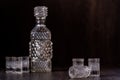 Cut Glass Crystal Decanter Set on Brown Background Royalty Free Stock Photo