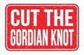 CUT THE GORDIAN KNOT, words on red rectangle stamp sign Royalty Free Stock Photo