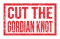 CUT THE GORDIAN KNOT, words on red rectangle stamp sign Royalty Free Stock Photo