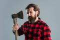 cut hair with ax. male hairdresser or barbershop. brutal butcher in shirt. lumberjack ready to work in forest. confident Royalty Free Stock Photo