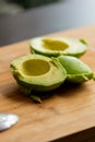 Cut in Half Avocado Close Up on Wooden Board - Fresh and Nutrient-Rich Delight