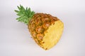 Cut half pineapple (Ananas) Royalty Free Stock Photo