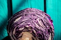 A cut half of a head of red cabbage lies on wooden boards Royalty Free Stock Photo