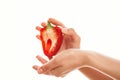 cut in half red pepper in hands on a light background vegetables