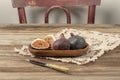 Cut into half and whole ripe figs on wooden table Royalty Free Stock Photo