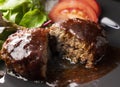 Cut the hamburger with demi-glace sauce in half