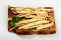 Cut Horseradish roots Armoracia rusticana taproot on rustic wooden board Royalty Free Stock Photo