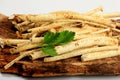 Cut Horseradish roots Armoracia rusticana taproot on rustic wooden board Royalty Free Stock Photo