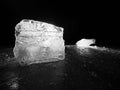 Cut ice. Crushed cubes lighted with strong backlight. Silent bay with flat frozen level.