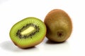 A cut kiwi and one quarter kiwi on a white background