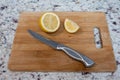 A cut lemon on a wooden cutting board Royalty Free Stock Photo