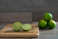 Cut limes on wooden tray Royalty Free Stock Photo