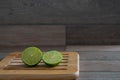 Cut limes on wooden tray Royalty Free Stock Photo