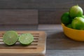 Cut limes on wooden tray Royalty Free Stock Photo