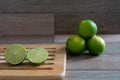 Cut limes on wooden tray Royalty Free Stock Photo