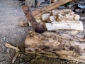 Cut logs firewood and old axe Royalty Free Stock Photo