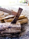 Cut logs firewood and old axe Royalty Free Stock Photo