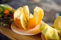 Cut melon on a white plate. Royalty Free Stock Photo