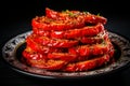 Cut multi-colored bell peppers into rings and stuff them. Colorful presentation in a plate on a black background