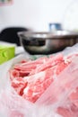 The cut mutton roll and the hot pot on the induction cooker Royalty Free Stock Photo