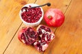 Cut open and whole pomegranate fruit