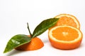 Cut Orange fruit with leaves isolated on white