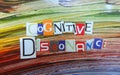 Cut out colored letters from magazines and compilation of cognitive dissonance Royalty Free Stock Photo