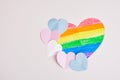 cut out colored paper hearts on gray background, transexual colors, lgbt pride concept