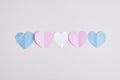 cut out colored paper hearts on gray background, transexual colors, lgbt pride concept Royalty Free Stock Photo