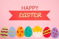 Cut out the felt applications of colorful eggs and the chicken hatched from the egg. Pink background. Flat lay. Happy Easter Royalty Free Stock Photo