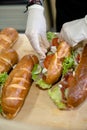 Cut out of man preparing sandwiches Royalty Free Stock Photo