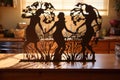 cut-out paper tree with dancing shadows on a wooden table Royalty Free Stock Photo