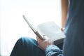 Senior man is reading a book at home, selective focus Royalty Free Stock Photo