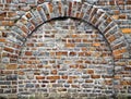 Cut out rocks in wall with arched brickwork