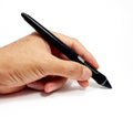 Object shot of a hand holding a graphics tablet pen isolated on a white background.