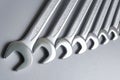 Cut-out wrenches horizontally placed from the biggest to the smallest in a row. Top view composition. Hand tool. Tools