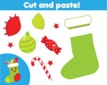 Cut and paste children educational game. Paper cutting activity. Make a Christmas sock with glue and scissors. DIY worksheet Royalty Free Stock Photo