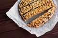 Cut pie into portion pieces for cooking on a wooden brown table. View from above