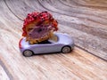 cut piece of berry eclair on toy car, delivery concept