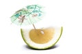 Cut piece of sweet green grapefruit with umbrella Royalty Free Stock Photo